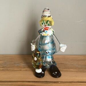 Murano glass clown figurine holding a guitar